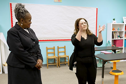 A woman working near servers