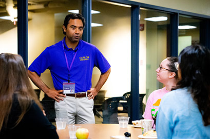 A woman working near servers